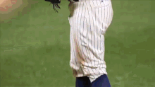 a baseball player with the number 8 on his jersey swings his bat