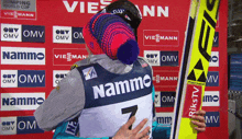 a person with the number 7 on their back hugging another person