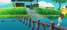 a man is jumping over a wooden fence into a lake while a woman stands on the stairs .