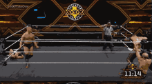 wrestlers in a ring with the time 11:14 on the screen