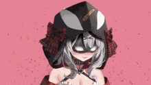 a girl is wearing a mask and a hood that says venom