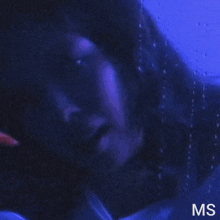 a picture of a woman in an airplane window with the letters ms on the bottom