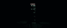 a woman is looking out of a window in a dark room .