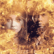 a man and a woman are surrounded by flames and the word bates is on the bottom left