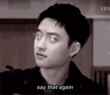 a young man is saying `` say that again '' while looking at the camera .