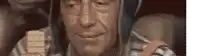 a close up of a man holding a piece of paper that says ' a ' on it