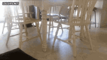 a table and chairs with lolgifs.net on the bottom