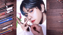 a person is drawing a picture of a boy with blue hair and a flower