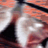 a blurry image of a person 's face with a red and white stripe