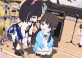 a girl with a guitar is kneeling next to a girl with a cat ear and an amplifier that says sikatime