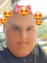a man with smiley faces on his head and a bow