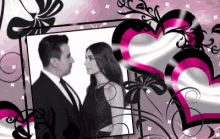 a black and white photo of a man and a woman surrounded by pink hearts