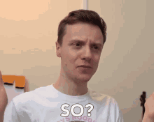 a man wearing a white shirt that says so
