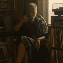 Sipping Tea Antlers Holst GIF - Sipping Tea Antlers Holst Michael Wincott GIFs