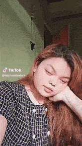 a woman 's face is shown in a tiktok video taken by lolchamberlain