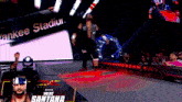 a wrestler named mike santana is walking down the ring at yankee stadium
