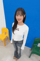 a girl wearing a shirt that says i heart girls