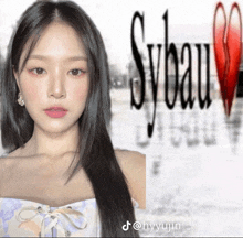 a woman with long black hair is standing in front of the word syeau