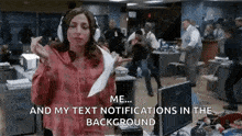 a woman wearing headphones is holding a piece of paper in her hand and dancing in an office .