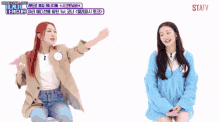 two girls are sitting next to each other and one has a speech bubble that says statv on it