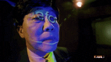 a man in a suit has the word efc on his face