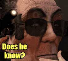 an older man wearing sunglasses and a flashlight says does he know