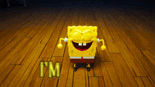 spongebob squarepants is standing on a wooden floor with the word i 'm written on it