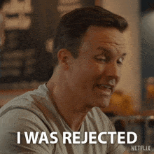 a man says i was rejected in front of a netflix logo