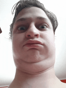 a man making a funny face with his eyes closed and his mouth open