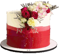 a cake with red and white frosting and flowers on top