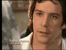 a close up of a man 's face with the words falha nossa o clone on the bottom