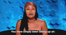a woman without a shirt is talking about taking up air .