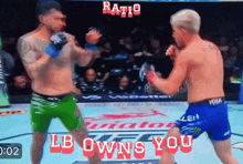 two men are fighting in a boxing ring with the words ratio lb owns you