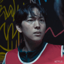 a close up of a man 's face with the word netflix on the bottom right