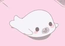 a white seal is laying on a pink surface .