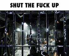 a picture of a prison cell with the words " shut the fuck up " above it