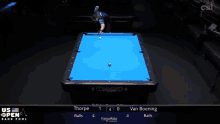 a pool table with a blue cloth and a diamond logo on it