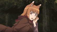 a girl with fox ears is wearing a brown hooded cape