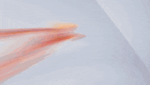 a man in a white suit is holding a sword with flames coming out of it