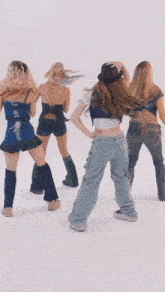 a group of women are standing next to each other on a white background .