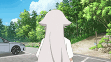 a woman with long white hair is standing in front of a white car