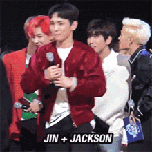 a group of young men standing next to each other with the name jin + jackson on the bottom