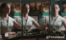 a woman is applying makeup in front of a mirror with the hashtag tvresidence