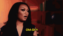 a woman in a blue dress is making a funny face and saying `` ohh shit '' .