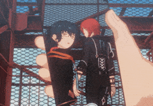 a hand is holding a picture of two anime characters with the letters xxx on the back