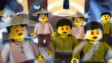 a group of lego figures are standing in front of a screen that says bilibili on it
