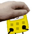 a hand is holding a yellow calculator with a black cord coming out of it .