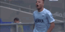 a soccer player wearing a seleco jersey is running on the field