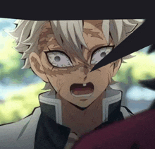 a close up of a person 's face with a sword coming out of it