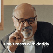 a man with glasses and a beard says " don 't mess with daddy " while pointing at his nose
